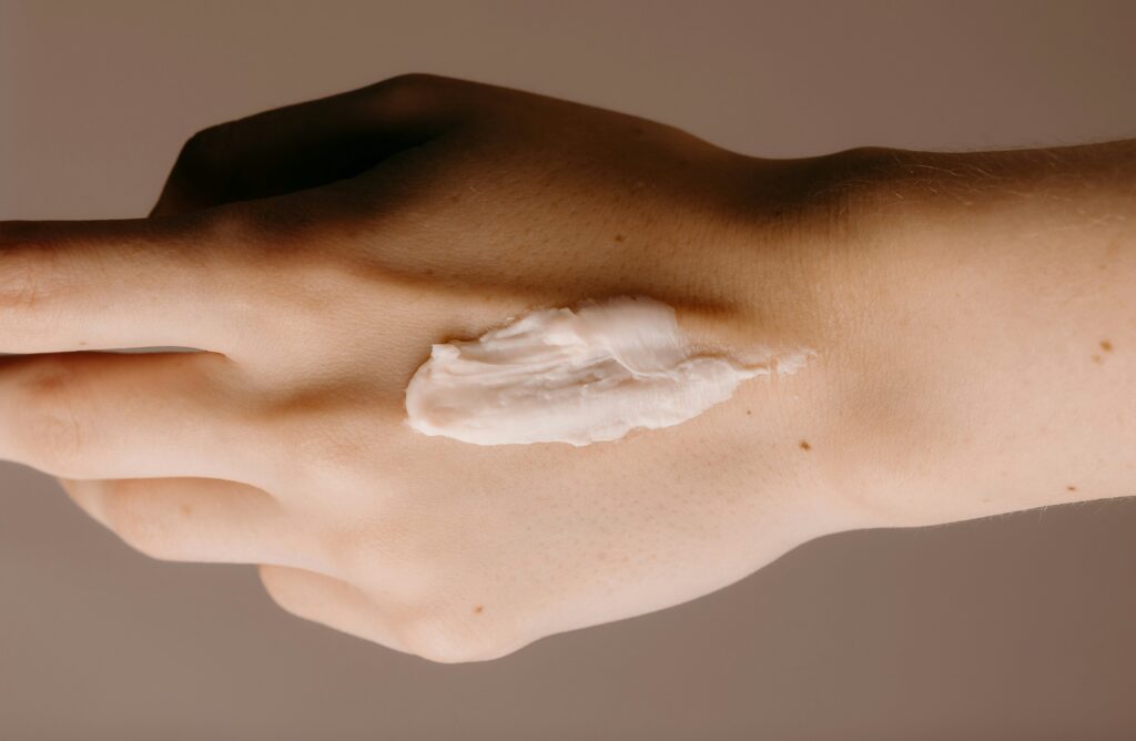 Topical personal care product with Lanolin Alcohol applied to the skin.