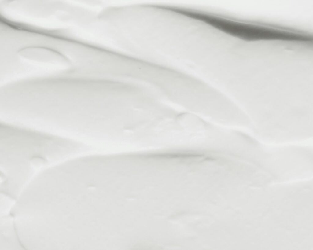 Rich cream formulation with anhydrous lanolin, showing its use in personal care products.