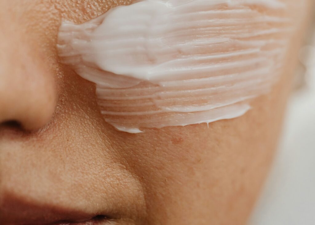 White cream applied to skin, illustrating the use of lanolin in pharmaceutical formulations.
