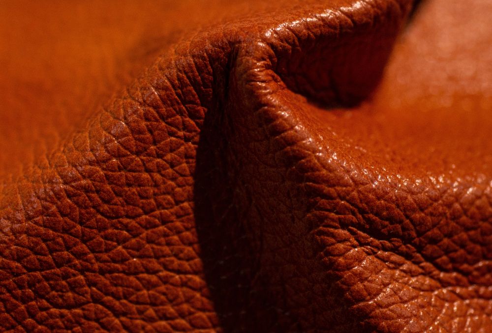 Leather surface illustrating applications of lanolin in leather treatment and conditioning