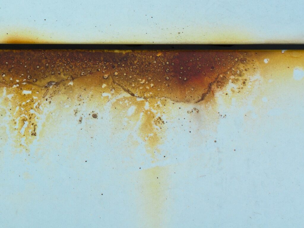 Corroded metal surface illustrating applications of lanolin in corrosion protection and rust preventio