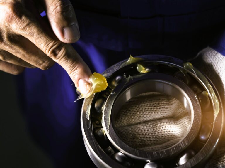 Lubricant applied to a metal component, illustrating technical applications of lanolin in lubrication and metalworking